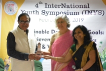 Prof. Pawan K. Chugan, Guest of Honor of Valedictory Function of 4th International Youth Symposium, B. K. School of Business Management, Gujarat University, Ahmedabad, is being honoured with Memento by Prof. Nilam Panchal, the chairperson of the Symposium.