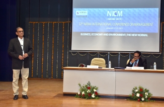 Prof. R. Parthasarathy, MEGA Chair Professor & Director, Gujarat Institute of Development Research, the chief guest and keynote speaker addressing the audience. Prof. P. K. Chugan is the Session Chair